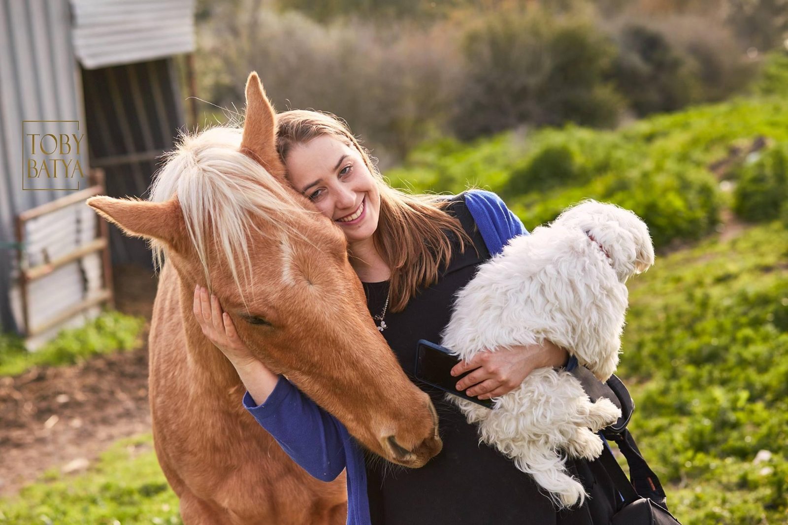 Tally with a horse and her dog